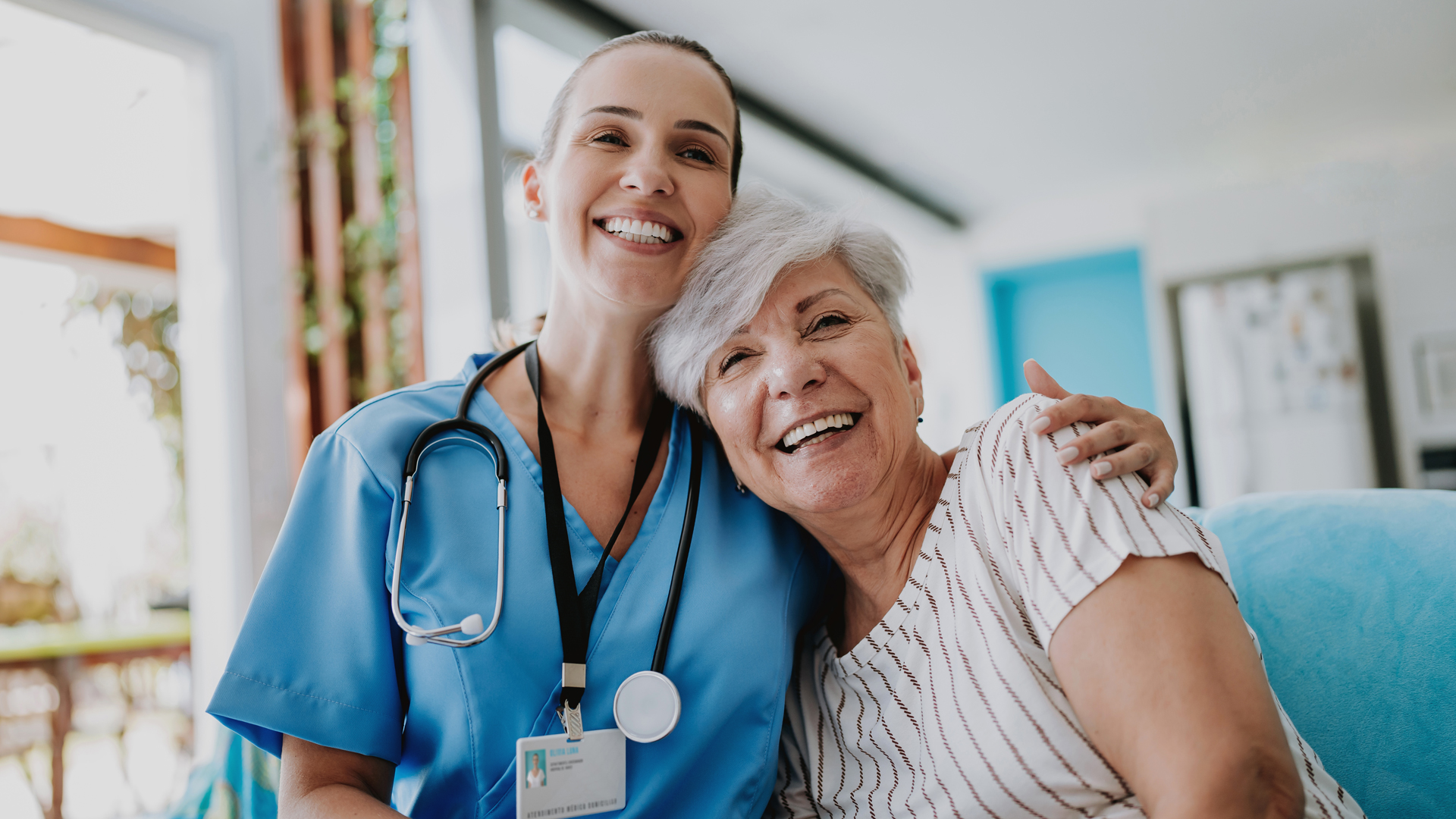 TitleHome care healthcare professional hugging senior patient, patient-centric research